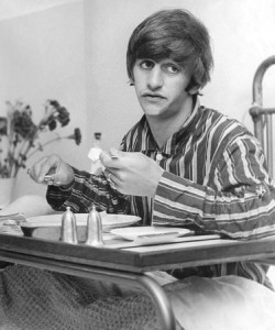 Ringo Starr pictured in his pyjamas in hospital eating a meal. T